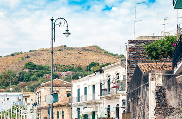 Travel to Italy -  historical street of Acitrezza, Catania, Sicily, facade of old buildings.