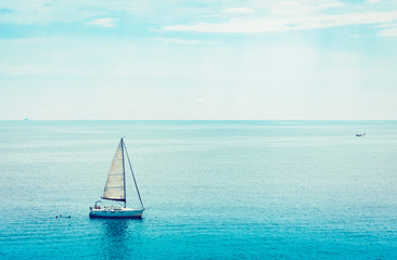 Fototapeta premium Sea view with sailboat, motor boat from Taormina, Sicily, Italy.