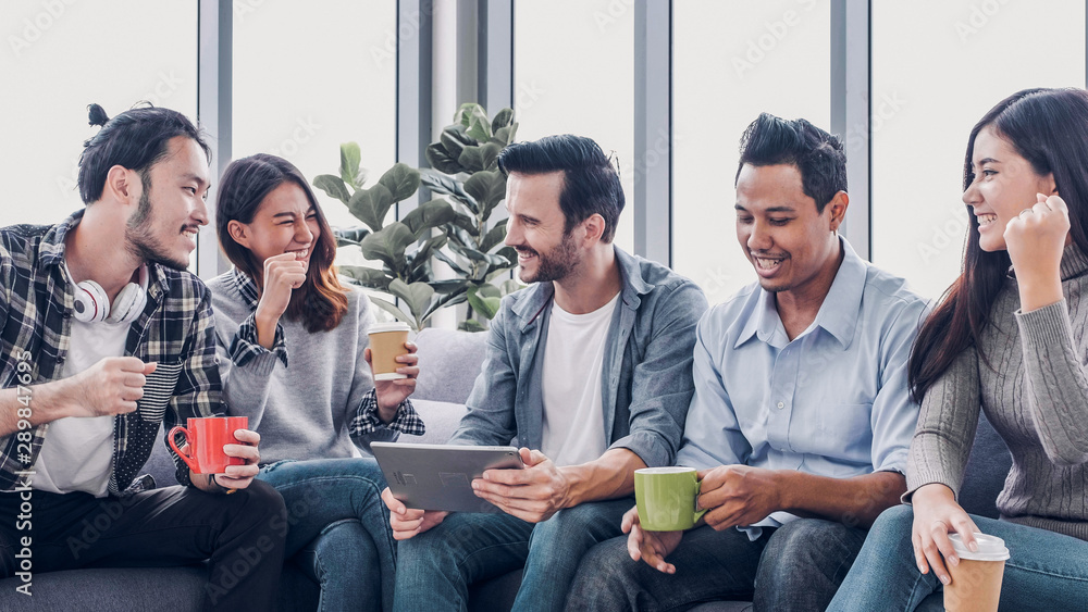 Poster creative office,designer team use tablet in casual meeting and arms up for project success at sofa a