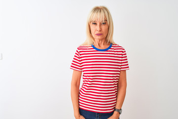 Middle age woman wearing casual striped t-shirt standing over isolated white background skeptic and nervous, frowning upset because of problem. Negative person.