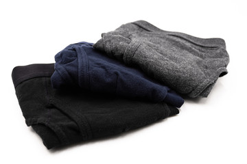 Three Folded Men's Briefs on White