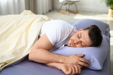 Obraz na płótnie Canvas Handsome man sleeping on pillow at home. Bedtime