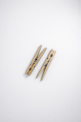 Two Clothespins on White