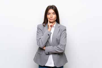 Young business woman over isolated white background Looking front