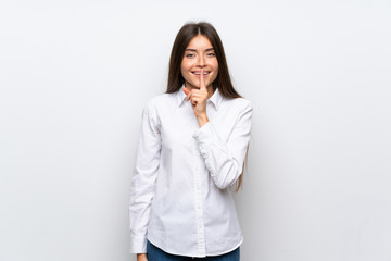 Young woman over isolated white background doing silence gesture