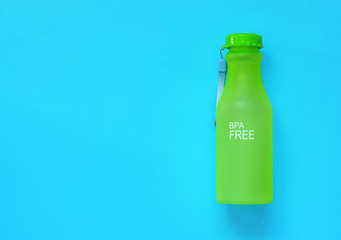 plastic reusable water bottle on a color background, zero waste concept