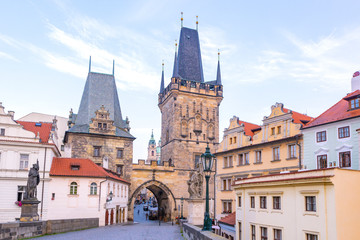 Fototapeta na wymiar Charles bridge, old towers and statues at sunrise, Prague, Czech Republic