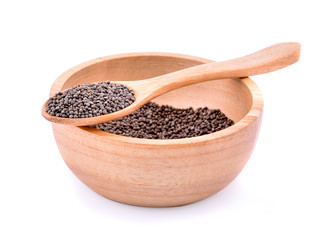 Perilla herb seed in wooden spoon on white background.