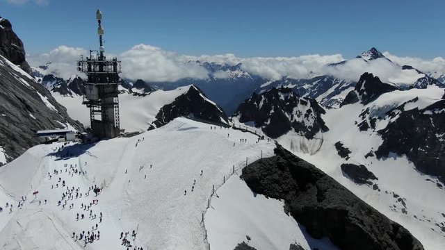 Drone view to the cable car station on the top of Titlis mountain. Shot was made in June.
