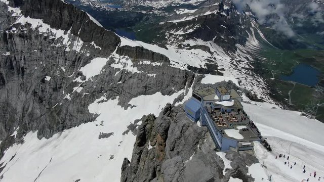 Beautiful drone view to the Titlis mountain, cable car and antenna in Switzerland. Shot was made in June.