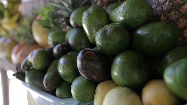 Exotic tropical fruits pineapple, papaya, coconut are in Philippines market on the way to El Nido