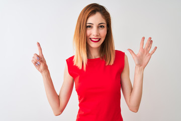 Redhead businesswoman wearing elegant red dress standing over isolated white background showing and pointing up with fingers number six while smiling confident and happy.