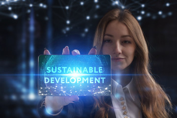 The concept of business, technology, the Internet and the network. A young entrepreneur working on a virtual screen of the future and sees the inscription: Sustainable development