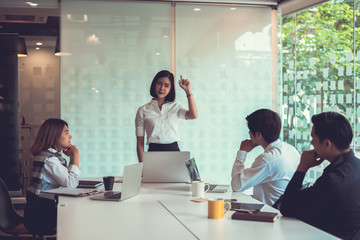 Young asian business group with the creative work, talk and exchange ideas shared at the meeting.