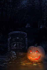 halloween pumpkin with grave headstone