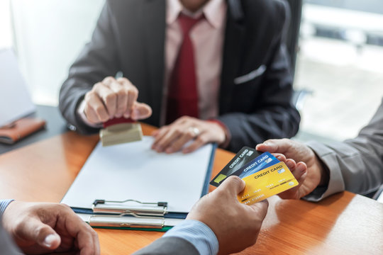 Groups businessman and credit cards. Credit cards approve. Payment via credit card reader machine.