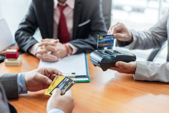Groups businessman and credit cards. Credit cards approve. Payment via credit card reader machine.