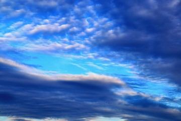 Stunning mixed cloud formation panorama  on a deep blue summer sky