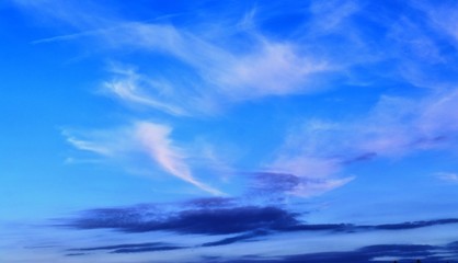 Stunning mixed cloud formation panorama  on a deep blue summer sky