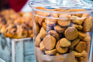 Shortbread cookies in glassware and other sweets on the buffet table during the coffee break