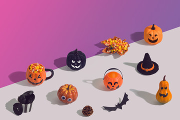 Halloween holiday creative background with jack o lantern, glitter pumpkin, candy corn and decorations