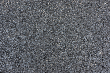 Brand new black asphalt pavement texture background