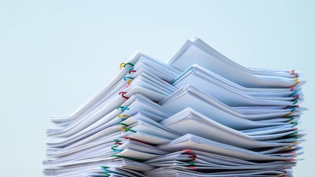Stack of document paper with colorful paperclip place on white background, business concept footage paperless used &ndash; Stop motion