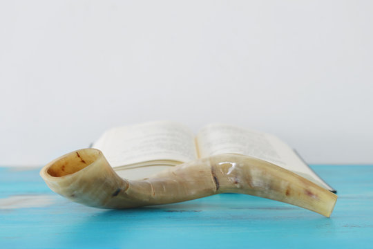 religion image of Prayer book and Shofar (horn) jewish religious symbols. Rosh hashanah (jewish New Year holiday), Shabbat and Yom kippur concept