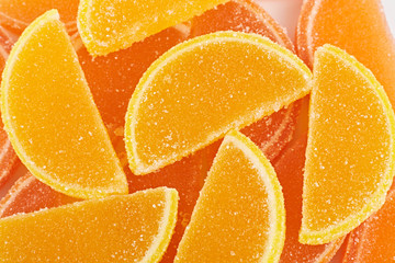 Marmalade isolated on white background. Jelly candy's. Dessert marmalade in the form of lemon and orange slices. The sweetness of jelly candy yellow and orange.