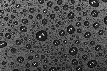 abstract water drops on a dark black  background