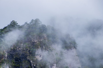 Viewpoint and green fields in the rainy season cover by fog at Doi Luang Tak, Tak Province,Thailand.