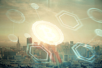 Double exposure of crypto currency theme hologram drawing and city veiw background. Concept of blockchain and bitcoin.