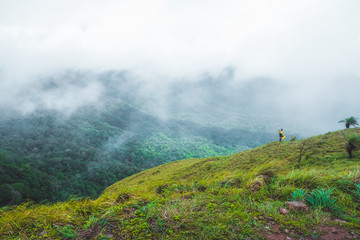 Viewpoint and green fields in the rainy season cover by fog at Doi Luang Tak, Tak Province,Thailand.