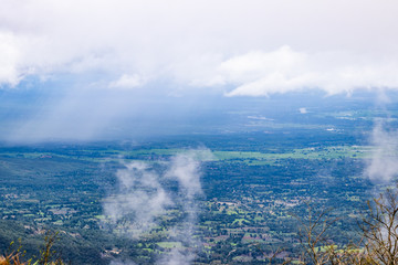 Obraz premium Viewpoint and green fields in the rainy season at Doi Luang Tak, Tak Province,Thailand.