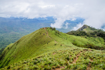 Fototapeta premium Viewpoint and green fields in the rainy season at Doi Luang Tak, Tak Province,Thailand.