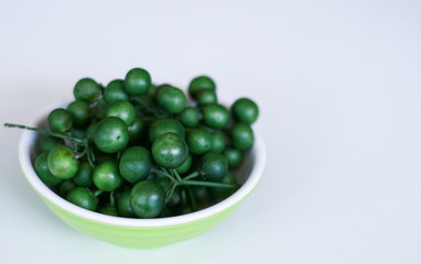 Leunca or Solanum nigrum on white background. 