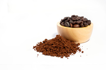 Closeup of coffee beans in wooden bowl and coffee powder on the floor. isolated on white