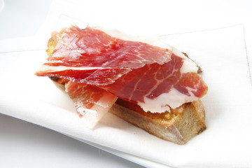 pincho aperitivo tapa de jamón serrano. Serrano ham tapas appetizer skewer.