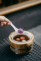 Black sesame dumpling in ginger tea