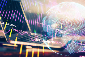 Multi exposure of graph and financial info and work space with computer background. Concept of...