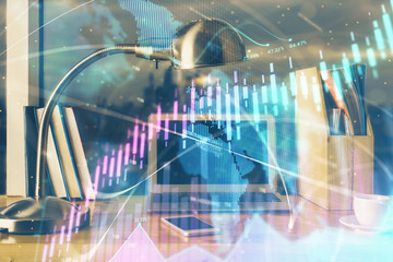 Forex market graph hologram and personal computer on background. Multi exposure. Concept of investment.
