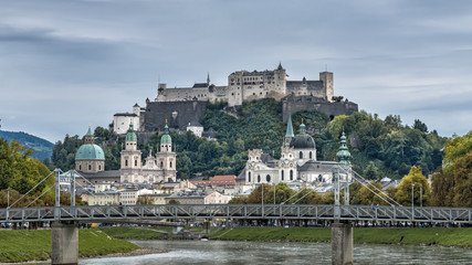 Fototapeta na wymiar City panorama of historical sights in baroque city Salzburg, Austria. Autumn city landscape with Festung Hohensalzburg and Salzach river
