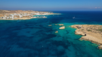 Aerial drone photo of famous sandy turquoise beach of Ammos and main port of Koufonisi island, Small Cyclades, Greece