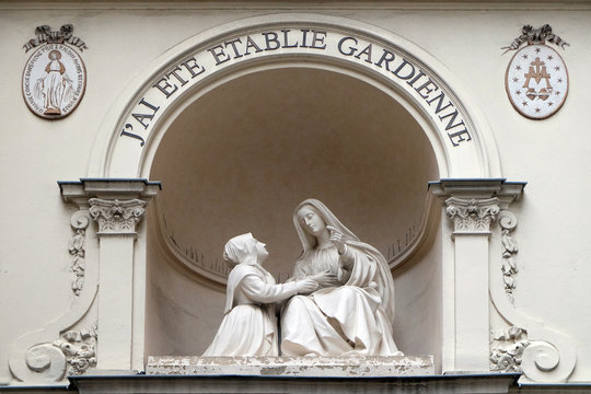Statue of St Catherine and the Virgin Mary outside the Chapelle Notre Dame de la Medaille Miraculeuse in Paris, France