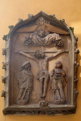 Fototapeta na wymiar Crucifixion, relief on the house facade in Rothenburg ob der Tauber, Germany