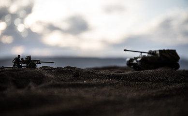 War Concept. Military silhouettes fighting scene on war fog sky background, World War German Tanks Silhouettes Below Cloudy Skyline At night. Attack scene.