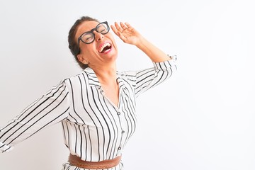Middle age businesswoman wearing striped dress and glasses over isolated white background Dancing happy and cheerful, smiling moving casual and confident listening to music