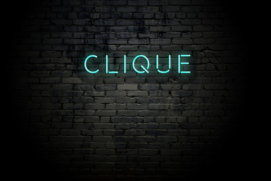 Highlighted brick wall with neon inscription clique