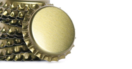 New golden bottle cap for beer isolated on white, side view, macro