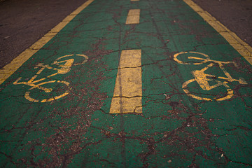 Bicycle sign on asphalt. Bicycle line in King Mihai I park (Herastrau park) in Bucharest, Romania, 2019.